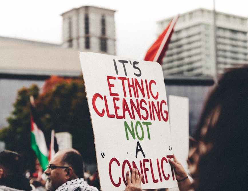 people with palestinian flags protesting on the street